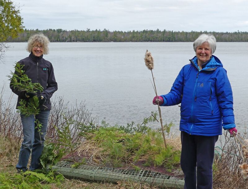 Gretchen and Char prepare the loon platform for the 2021 nesting season